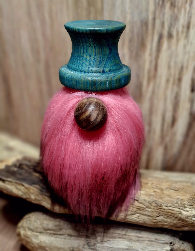 Wooden hand crafted gonk with teal blue hat and pink beard